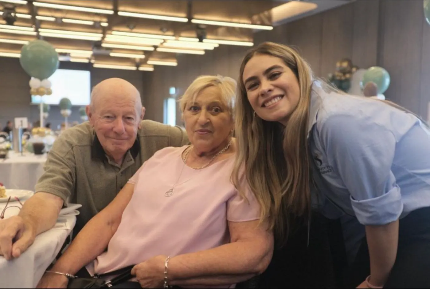 Maria Camila Van Arcken of Community Home Care Services with two clients at a community event in Sydney